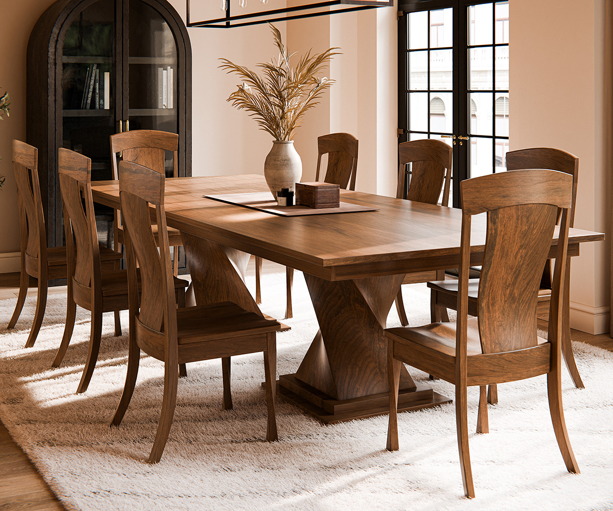 Sculptural trestle table with eight chairs—solid wood dining room furniture on plush rug.