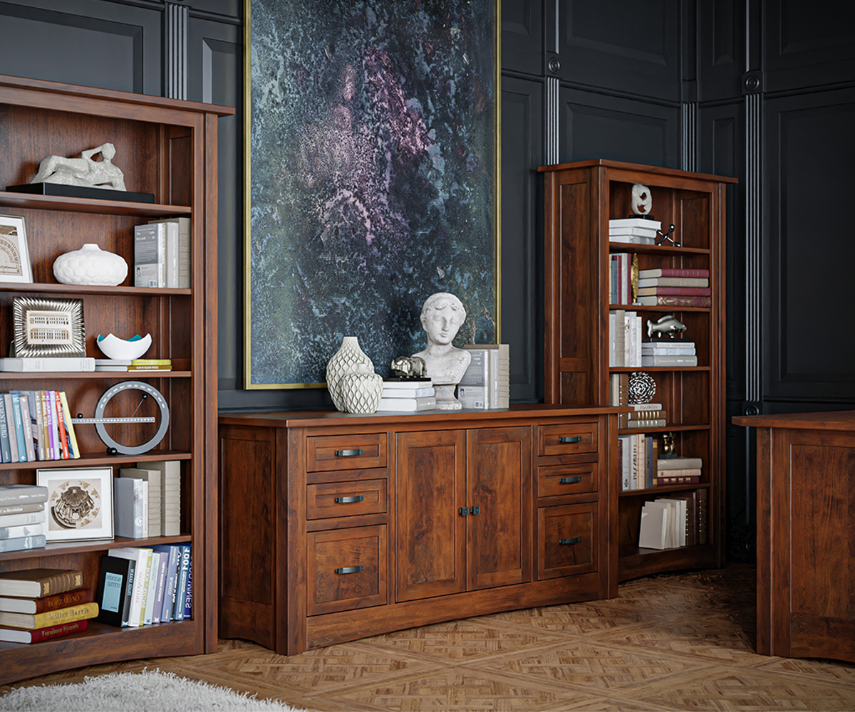 Office furniture warm wood credenza and bookcases against dark paneled wall